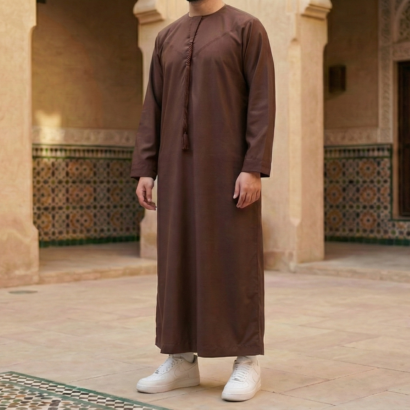 dark brown Emirati thobe with detachable tassel
