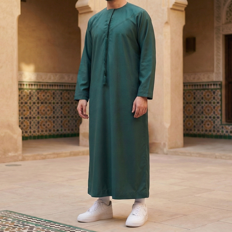 Dark emerald green Emirati thobe with removable tarboush tassel and zip worn for Ramadan, Eid, and everyday use