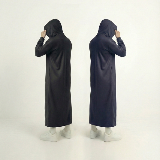 Man wearing black Signature Hooded Thobe with 330GSM fabric showing winter warmth and practical design for UK Muslims