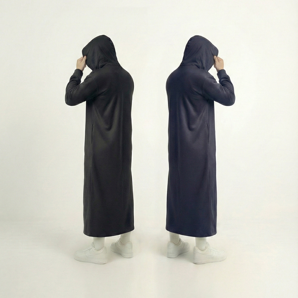 Man wearing black Signature Hooded Thobe with 330GSM fabric showing winter warmth and practical design for UK Muslims