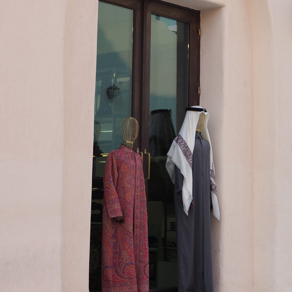 different thobe styles shown on mannequins