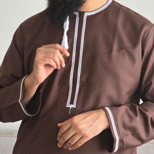 Brown Omani thobe with white embroidery and traditional tassel worn for prayer, Ramadan and Eid in the UK