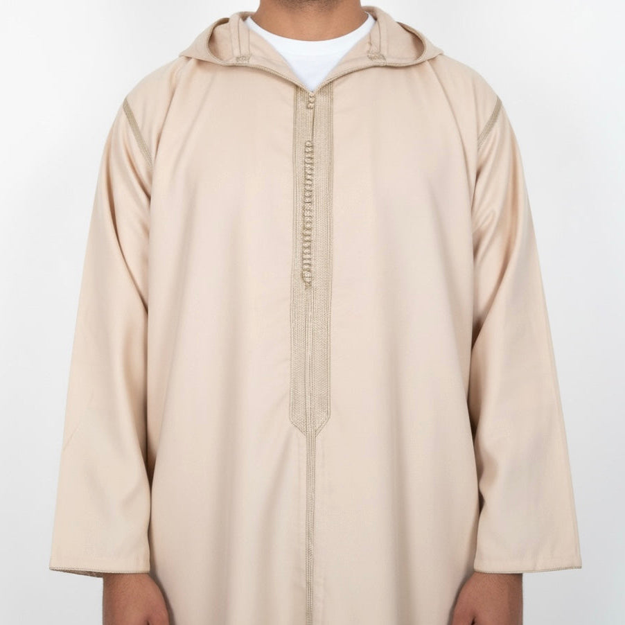 man wearing cream colour hooded Moroccan Djellaba with centre embroidery