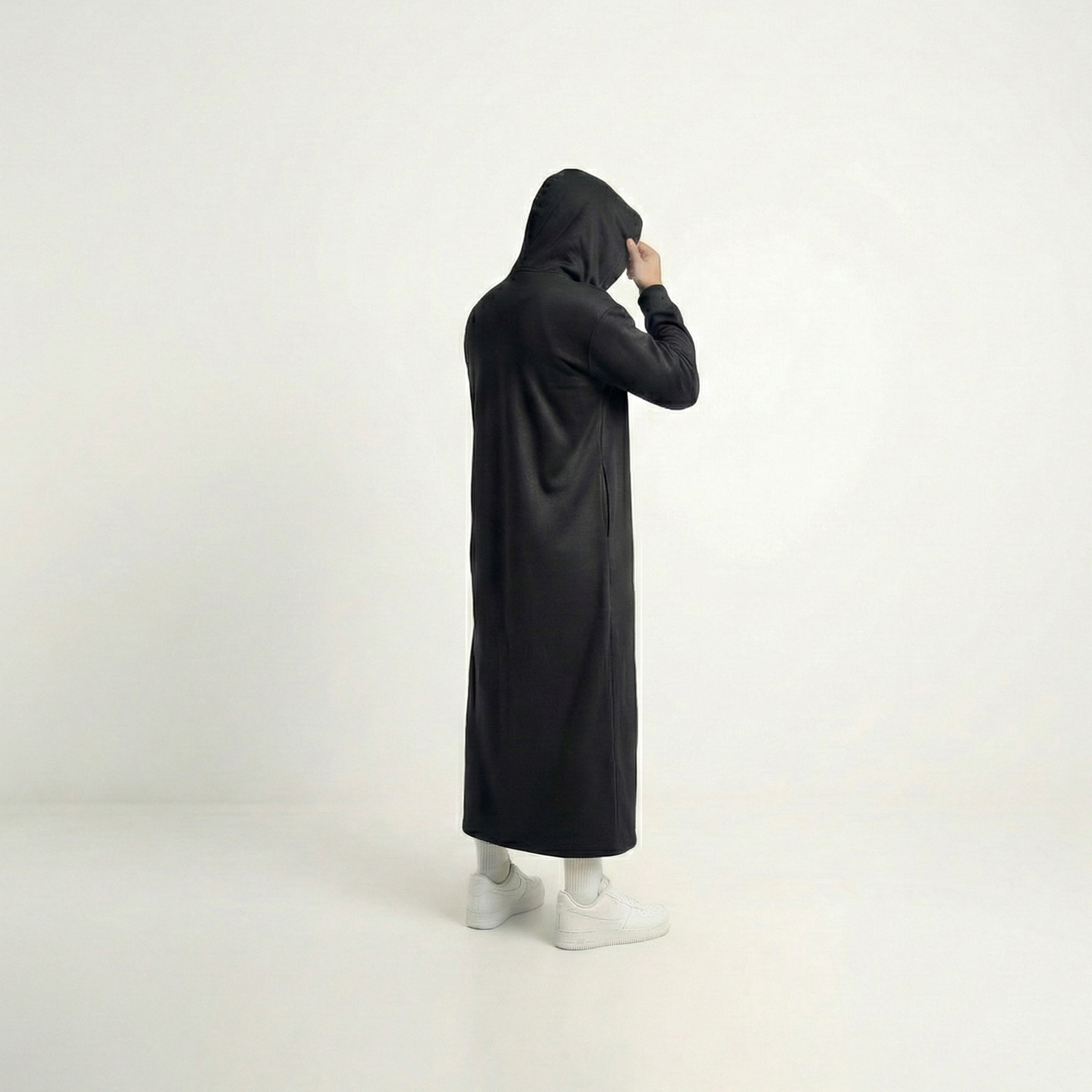 Hooded thobe with curved hood and ribbed cuffs