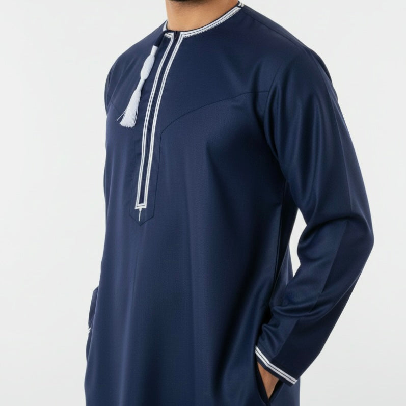 Premium Navy Blue Omani Thobe with with White Embroidery. Featuring a Zip and Removable/Detachable Tassel