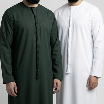 two men wearing dark green emirati thobe and white emirati thobe