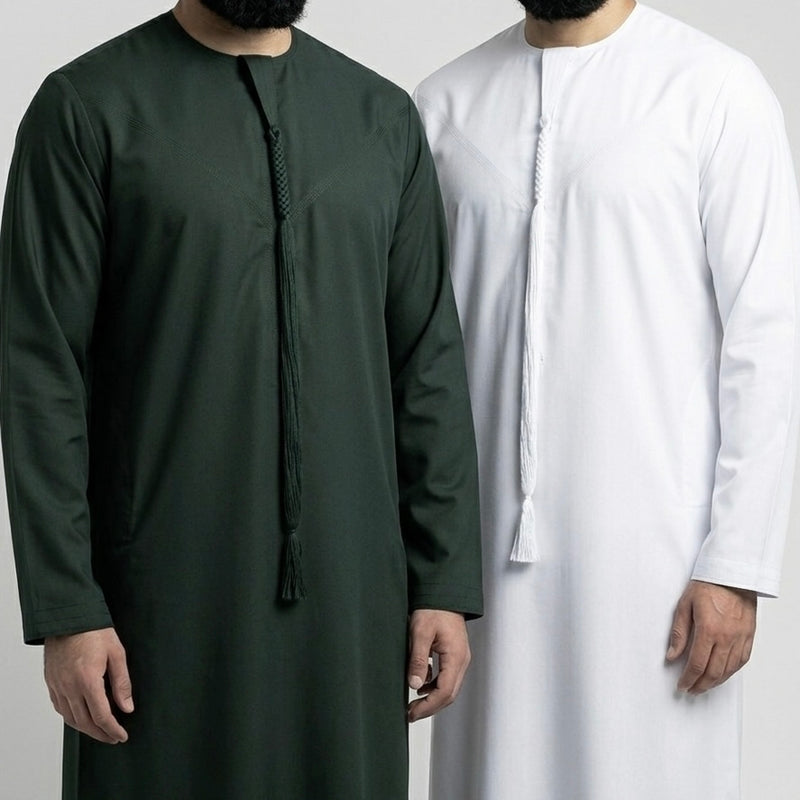 two men wearing dark green emirati thobe and white emirati thobe