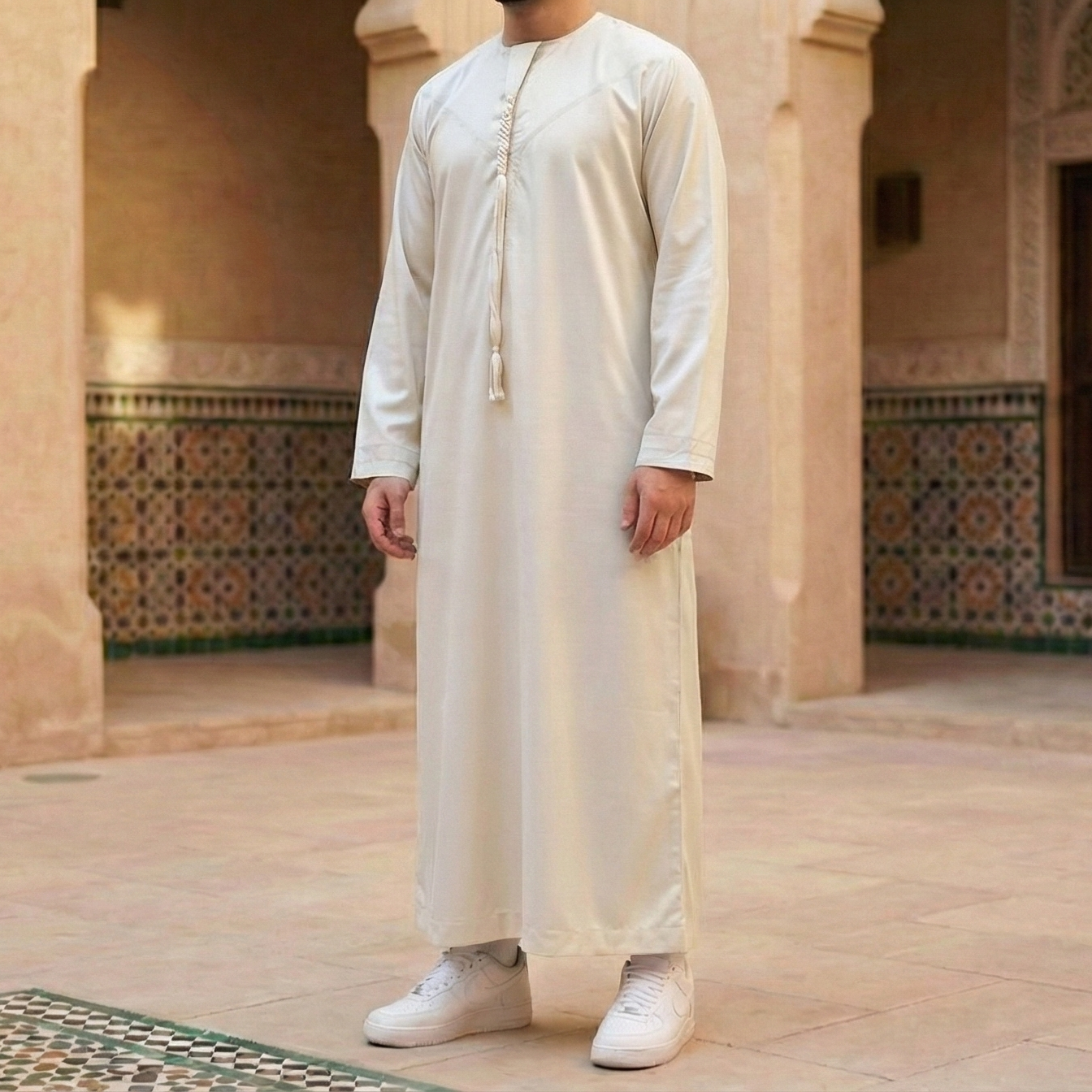 off white Emirati thobe with detachable tassel